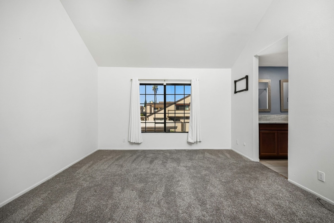 An empty, unfurnished listing room